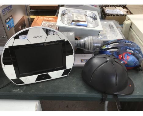 A FOOTBALL TELEVISION, A JET ENGINE, TWO LIGHTS AND TWO BIKE HELMETS 