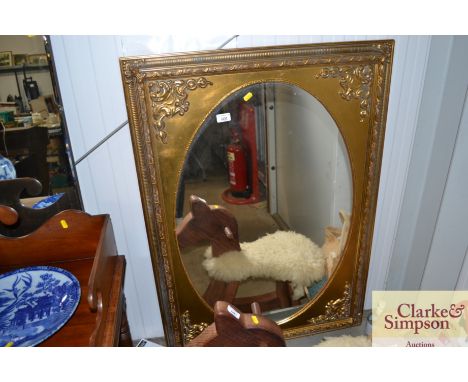 A gilt framed wall mirror