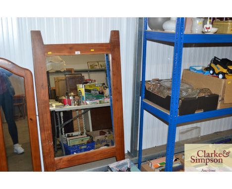 A large hardwood surround mirror