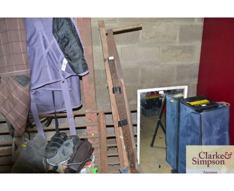 A pair of sash clamps; a slasher and a cross cut saw