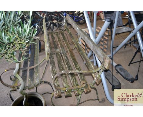 A metal and wooden garden bench