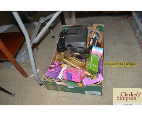 A box containing various sundry items to include a projector sold as collectors item; a bottle of "The Huntsman" aftershave; 