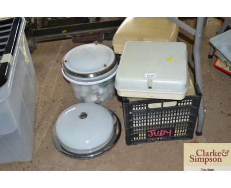 A quantity of various light fittings and a plastic bucket containing various light bulbs 