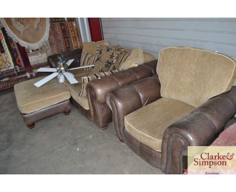 A suite comprising of a two seater settee; a matching armchair and a matching pouffe 