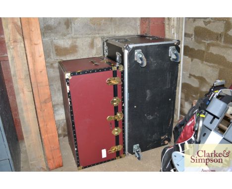 A travelling trunk (locked) and a flight trunk lacking one wheel