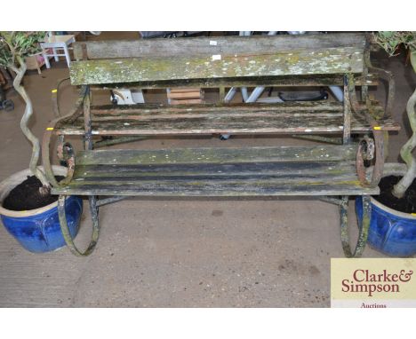 A metal and wooden garden bench