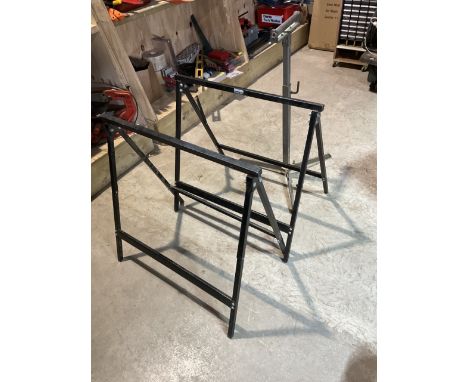 A pair of folding stands and a height adjustable roller stand