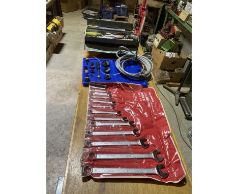 A steel cantilever tool box containing tools and accessories and items mostly related to electrical work also 3 heavy steel r