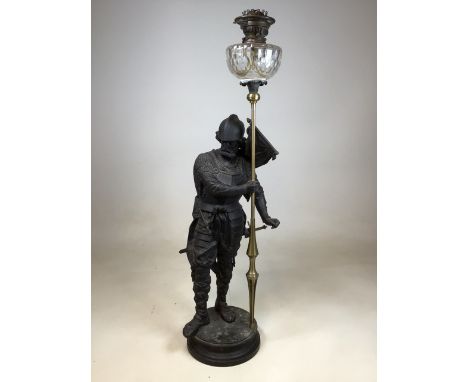 A large figural spelter oil lamp of an armoured soldier supporting lamp W:36cm x H:103cm