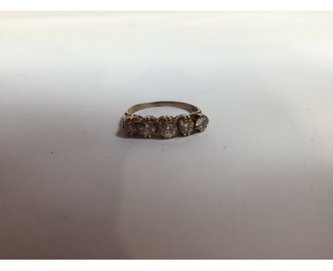 Five diamond ring on gold band - no hall mark, total weight 2 gm. Size 7. Width of largest diamond 4mm 