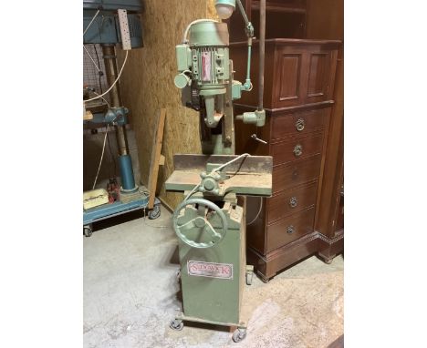 A large floor standing mortising machine with work light