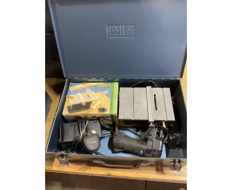 Two metal carry cases one containing wooden spheres and knobs the other containing mini tools from mini craft