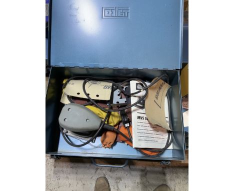 A metal carrying case containing a sander and sanding paper is also a metal carrying case containing engraving equipment