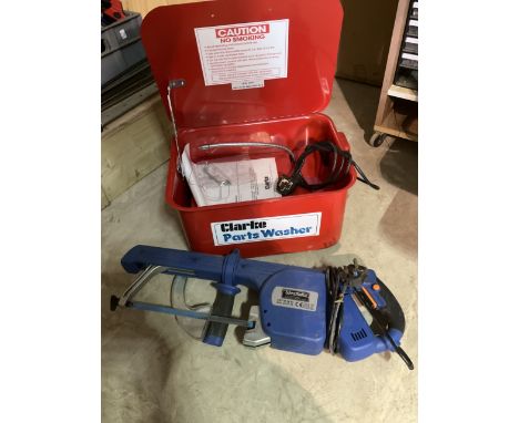 A power washing station and a handheld electric hacksaw