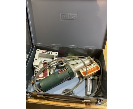 Two metal carry cases containing metabo  nibbler and shears one metal carry case containing Metabo die grinder