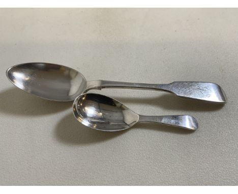 A silver caddy spoon also with a silver desert spoon. 69 grams.