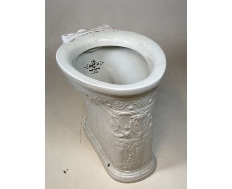A rare late Victorian white moulded ceramic toilet pan, the Rapid Washdown Closet with anthemion/acanthus and leafy scroll pa