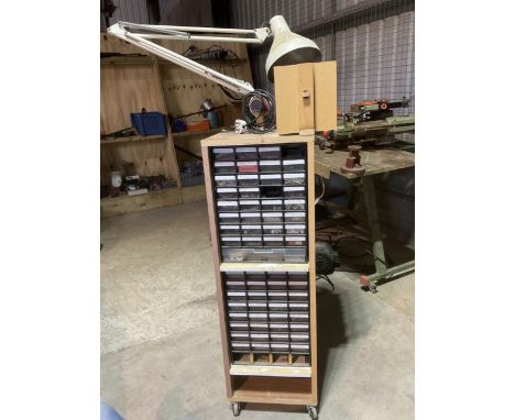 A tall workshop storage unit with mounted light and abrasives over 100 draws with a variety of useful workshop items and fast