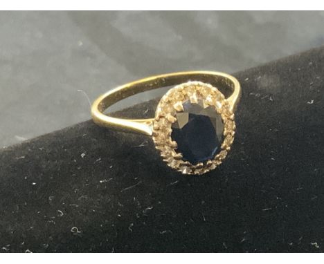 A Sapphire and diamond cocktail 9ct gold ring.  Size R.