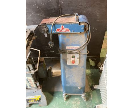 A floor standing belt sander linishing machine