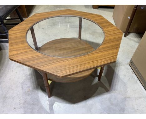 A mid century octagonal coffee table with circular glass insert, lower shelf with metal supports.W:75cm x D:75cm x H:40cm