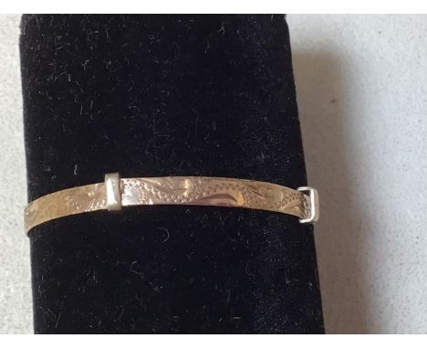 A 9 carat gold babys christening bangle - approx weight 3gm 