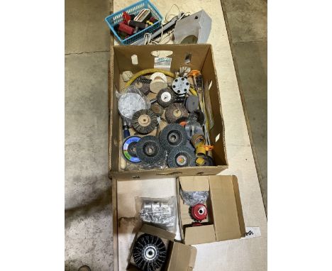 A collection of workshop tool equipment including an inspection magnifying lamp flat wheels abrasive discs and wire cup brush