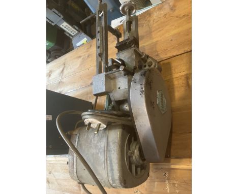 A vintage engineers powered hacksaw