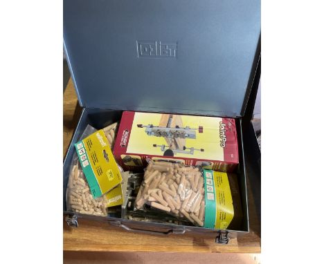 Metal carry case containing wood Dowling tools and dowels and another metal carry case containing riveting tools and rivets