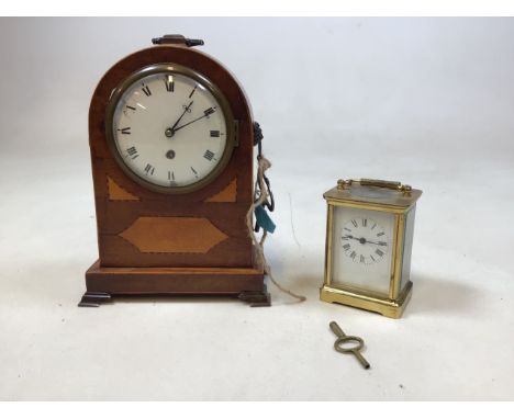 A inlaid mahogany cased mantle clock in as found condition also with a small carriage clock W:18cm x H:24cm Mantle clock W:8c