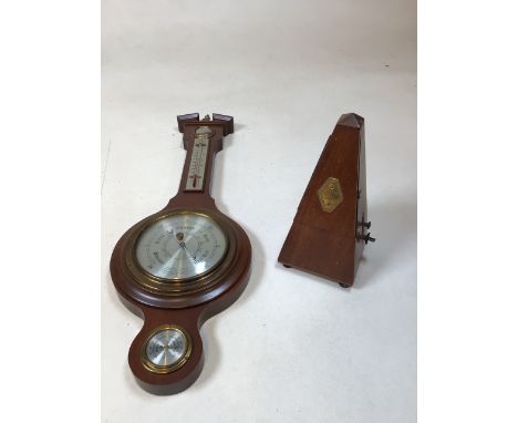 A Comitti of London banjo barometer, a metronome MaelzelW:20cm x H:59cm Barometer