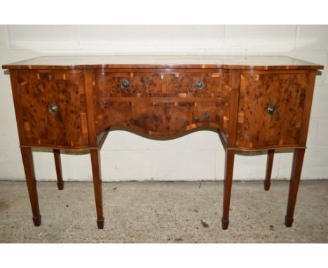 HIGH QUALITY BIRDS EYE MAPLE SERPENTINE SIDEBOARD, RAISED ON TAPERED LEGS, TWO DRAWERS FLANKED BY CUPBOARDS WITH CROSS-BANDED