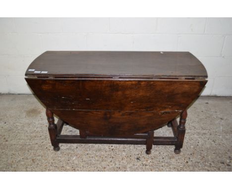 18TH CENTURY AND LATER OAK GATE LEG TABLE, THE LATER TOP RAISED ON RING TURNED SUPPORTS, JOINED ALL ROUND BY STRETCHERS, 122C