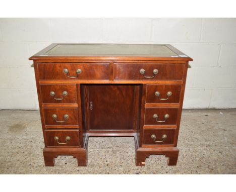 REPRODUCTION SMALL MAHOGANY TWIN PEDESTAL DESK WITH GILT GREEN TOOLED LEATHER INSERT, TWO FRIEZE DRAWERS AND SIX FURTHER DRAW