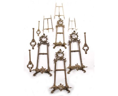 A collection of gilt metal easel stands