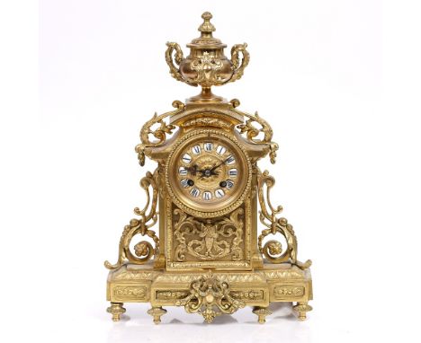 A 19th Century French mantel clock the convex dial with black and white ceramic chapters, Marti drum movement with outside co