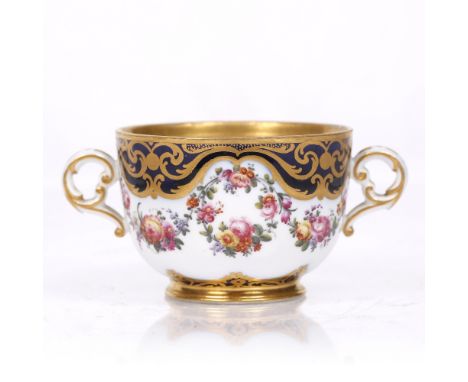 A French, probably Sevres, two handled cup painted with sprays of flowers, early 19th Century, 11cm