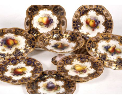 A Royal Worcester fruit service to include two square serving dishes signed by A. Shuck, one unsigned, an oval serving dish a