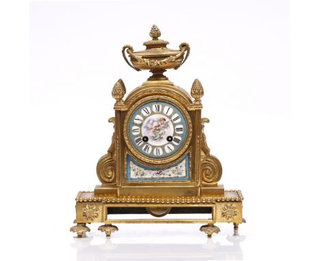 A 19th Century French mantel clock the convex porcelain Roman dial decorated with a cherub, drum movement with bell strike an