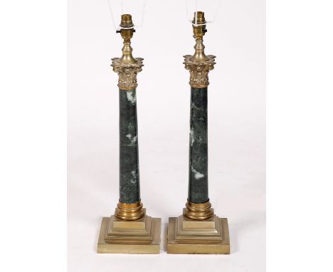 A pair of marble and silvered metal table lamp bases 48cm high