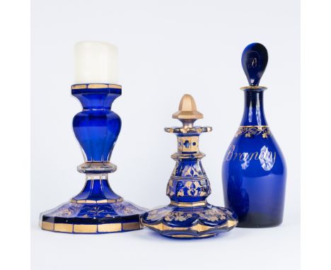 A pair of 19th Century blue and gilt candlesticks 18.5cm, a similar scent bottle and a Bristol blue glass brandy decanter (3)