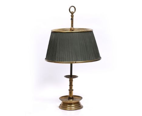 A brass student style table lamp with an adjustable column