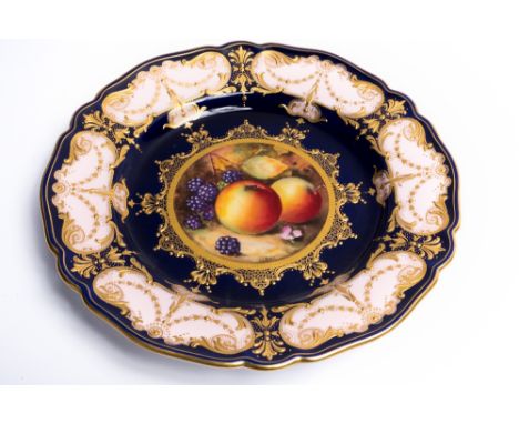 A Royal Worcester cobalt fruit/dessert service each piece painted with fruit by R. Sebright within a pink and gilt reserve bo