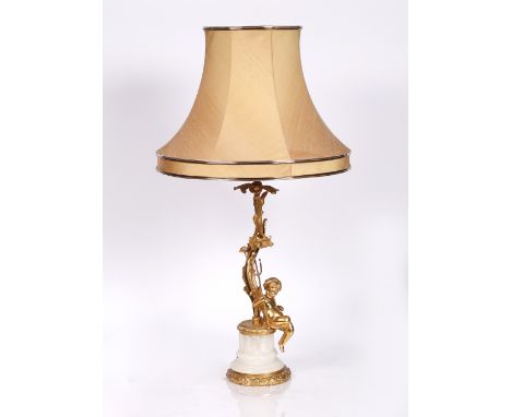 A gilt metal and onyx cherub table lamp and shade 45cm