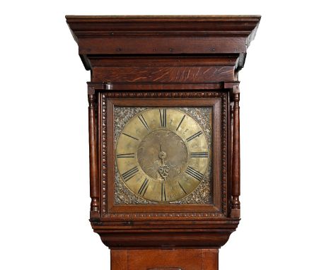 An oak thirty hour longcase clock with an 11 1/4" square brass Roman dial signed Lomax, Blackburn, the matted centre with dat