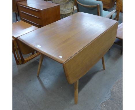 An Ercol Blonde elm and beech Windsor drop-leaf table 