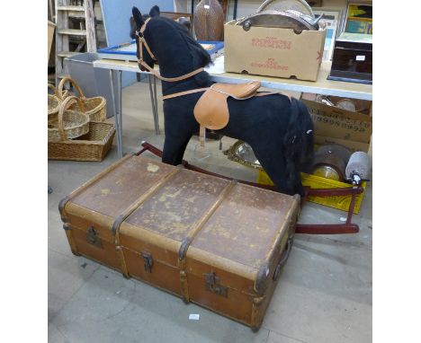 A beech and felt childs rocking horse and a vintage steamer trunk 