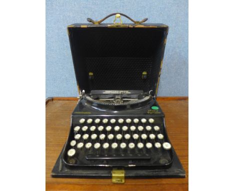 A vintage cased Remington Home Portable typewriter 