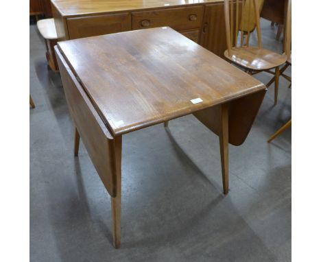 An Ercol Blonde elm and beech Windsor drop-leaf table 