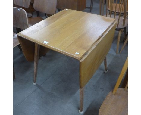 An Ercol Blonde and beech Windsor drop-leaf table 